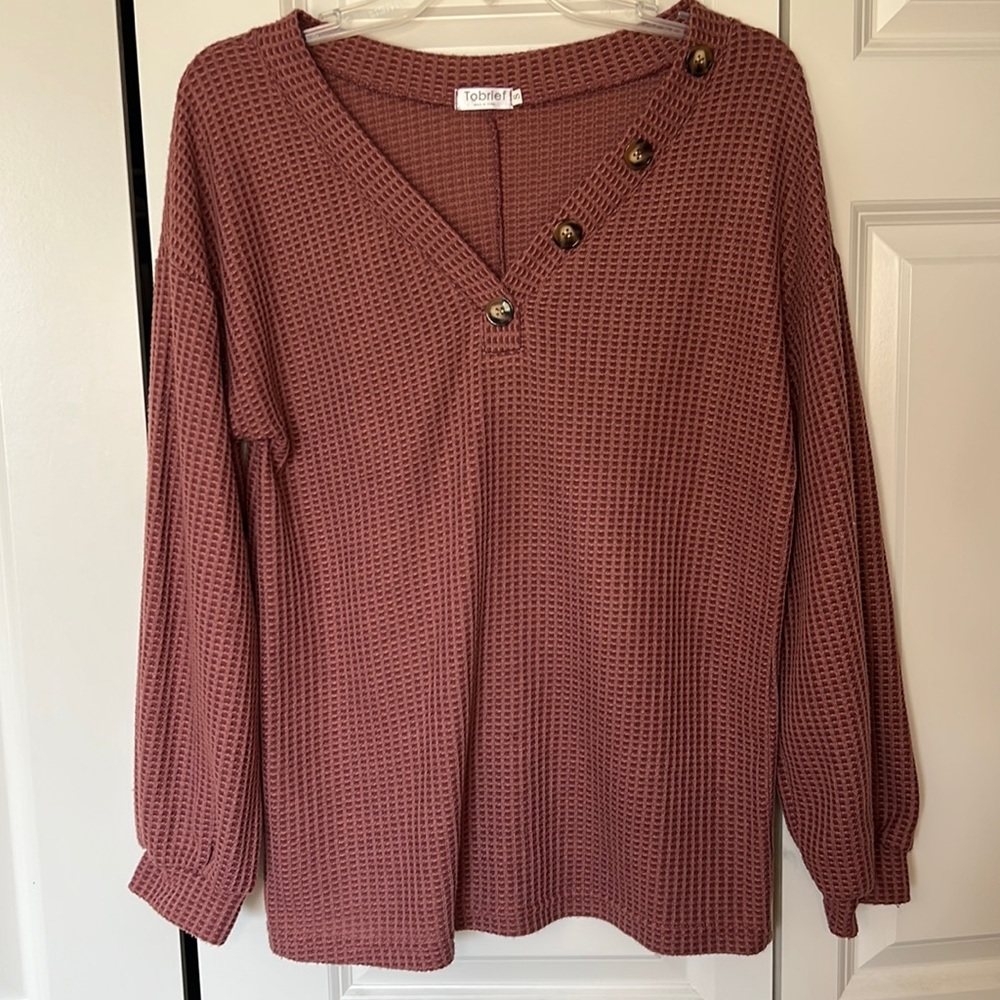 Pink loose sweater. It’s light and prefect for fall